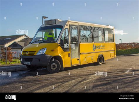 A school coach in the local Education Authority livery used for