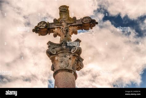 Low Angle View Of An Ancient Statue Of A Jesus On The Cross Under The