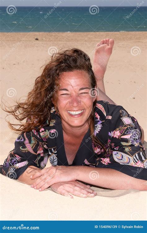 Trendy Brunette Woman On A Sandy Beach Smiling Happy Stock Image Image Of Trendy Smiling
