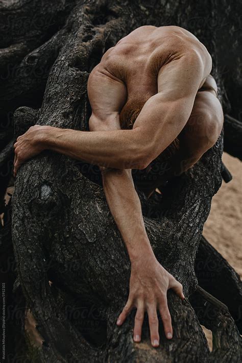 Redhead Nude Man Bare Chested Athlete Posing Near Tree Roots Outside By Stocksy Contributor