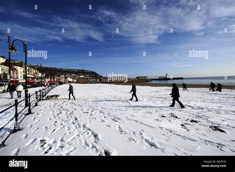 Walking On The Beach At Scarborough Yorkshire Following Heavy Snow