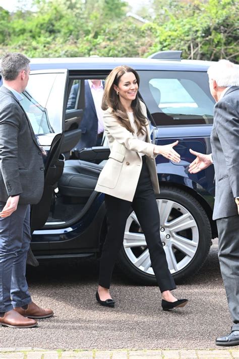 Kate Helps Fold Baby Clothes On Visit To Baby Bank Donation Centre