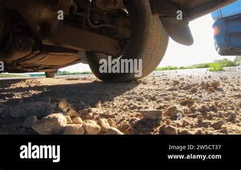 Wheel of black car slipping on a asphalt road during start of movement ...