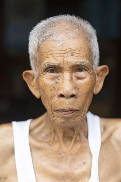 Thai Old Man In White Vest Shirts Portrait Of Happy Mature Asian Man He Standing In Old Home