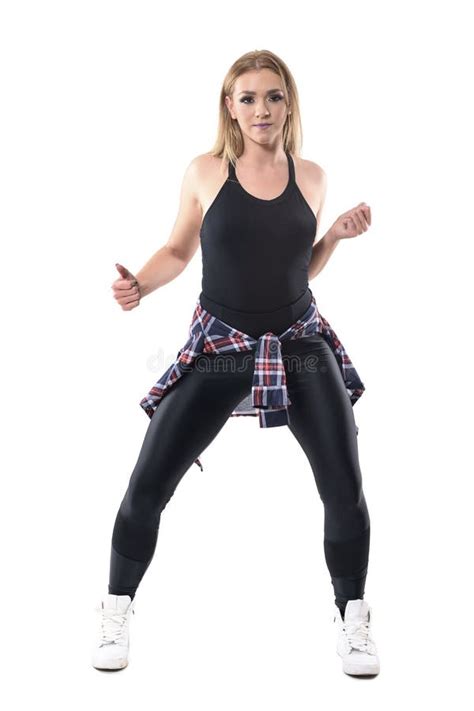 Front View Of Attractive Blonde Woman Dancing Jazz Dance Aerobics Looking At Camera Stock Photo
