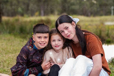 image  portrait   siblings sitting   austockphoto