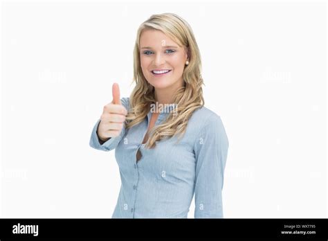 Blonde Woman Smiling While Showing Thumbs Up Stock Photo Alamy