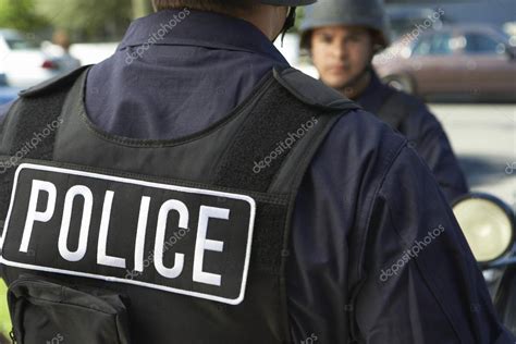 Police officer in bulletproof vest outdoors — Stock Photo ...