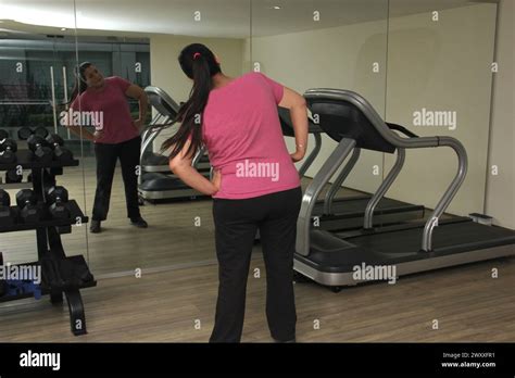 Year Old Latina Woman Stretches To Exercise At The Gym To Improve Her Health And Avoid