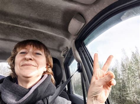 Funny Middle Aged Woman In A Car Taking Selfie While Enjoying Drive Female Mature Driver Posing