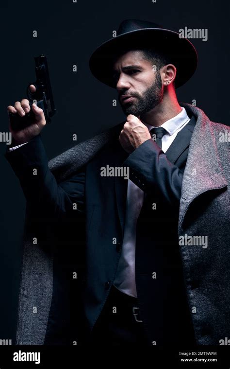 Gangster Leadership Or Holding Gun On Studio Background In Dark Secret
