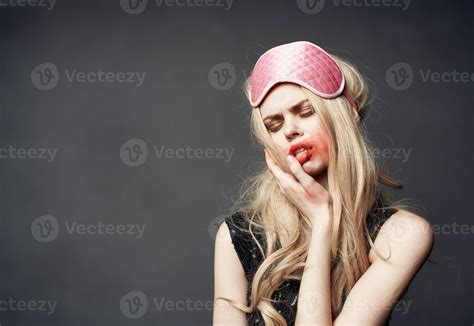 Drunk Blonde With Pink Sleep Mask Smears Lipstick All Over Her Face Stock Photo At Vecteezy