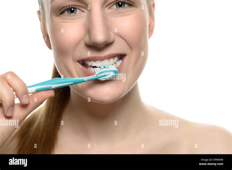 Attractive Naked Woman Brushing Her Teeth With A Toothbrush In A Medical Dental Care And Oral