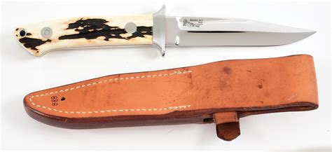 Lot Detail BOB LOVELESS STAG HANDLED BOOT KNIFE WITH DOUBLE NUDE LOGO AND MATCHING LEATHER SHEATH