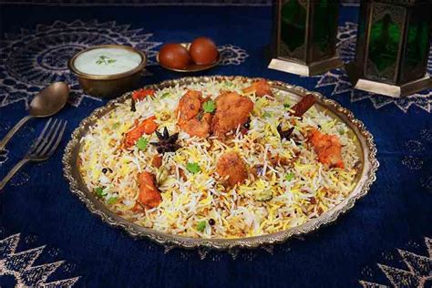 Order Murgh Tikka Biryani Chicken Tikka Biryani Serves 2 from Behrouz Biryani on EatSure