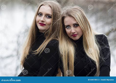 Two Beautiful Girls With Blonde Hair Stock Photo Image Of Brunette Fashion 64419812
