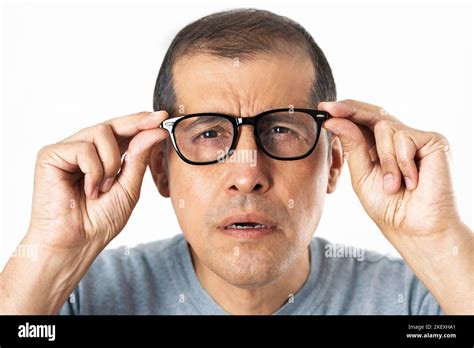 Adult With Glasses Straining His Eyes Because He Cant See Isolated