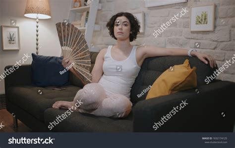 Woman Feeling Hot And Trying To Refresh In Summertime Heat Over Royalty Free Licensable