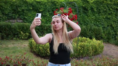 Blonde Woman Taking Selfies In The Park Video Stock Video Video Of Emotion Outfit