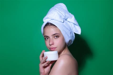 Premium Photo Beauty Portrait Of A Beautiful Half Naked Woman Applying Face Cream Isolated On