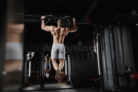 Fitness Man Pumping Up Muscle Doing Pull Ups Exercises In Gym Naked Torso Handsome Strong