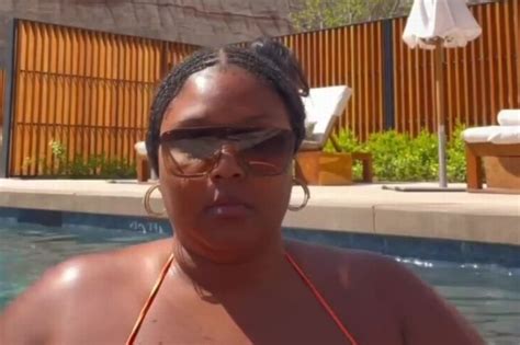 Lizzo Parades Her Curves In A Tiny Orange Bikini On