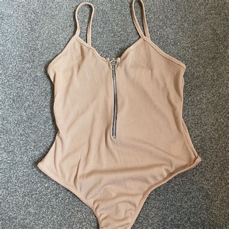 Nude Zip Up Ribbed Bodysuit Never Been Depop