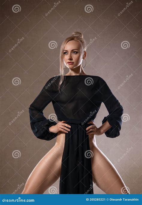 Beautiful Blonde Nude Woman With Perfect Legs In Black Dress And High Heels Stock Image Image