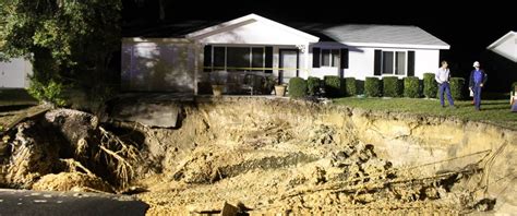 Massive Sinkhole Threatens To Swallow Homes In Florida Neighborhood