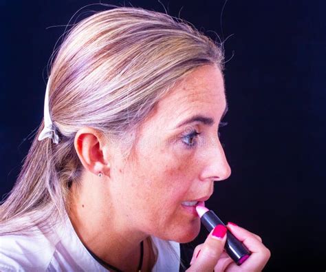 Blonde Lady Does Her Own Makeup Accentuating Her Lips Stock Photo Image Of Blond Locks 367661772