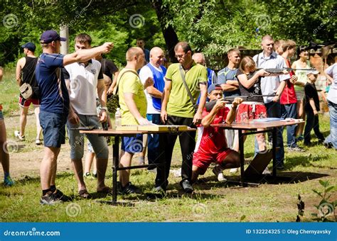 Man Shows His Neighbor How To Shoot Sports Pistol At Amateur Editorial Image Image Of