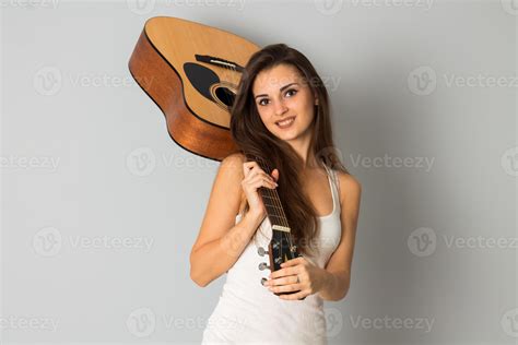 Beautiful Brunette Woman With Guitar In Hands 16492928 Stock Photo At Vecteezy