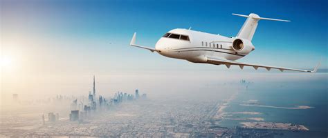 Private Jet Plane Flying Above Dubai City Monmouth Jet Center
