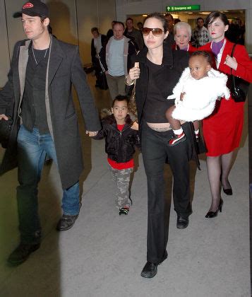 Count Brad Pitt And Angelina Jolie Arriving At Heathrow Airport