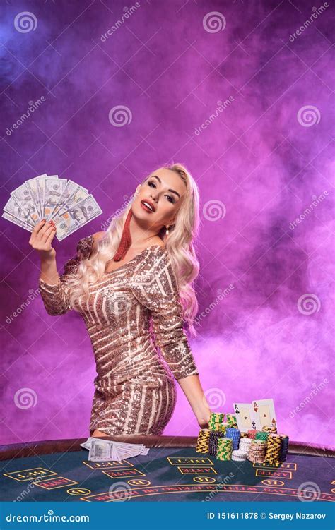 Blonde Woman With A Perfect Hairstyle And Bright Make Up Is Posing With Playing Cards In Her
