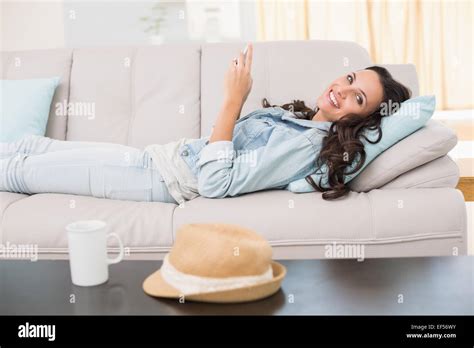 Pretty Brunette Texting On The Phone Stock Photo Alamy