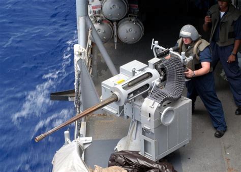 Us Navy Sailors Firing The Powerfull Mk38 M242 Bushmaster On A Boat