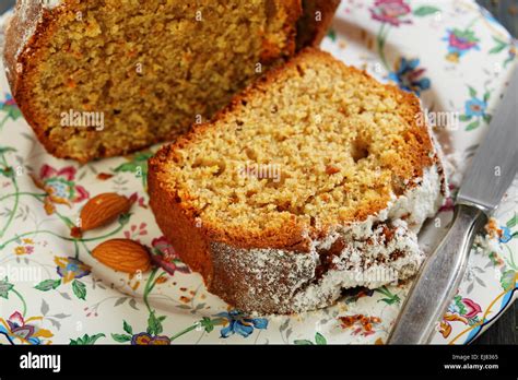 Piece Of Orange Cake With Almonds Stock Photo Alamy