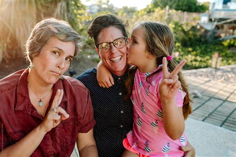 Lesbian Parents With Daughter Outdoors By Stocksy Contributor Erin Brant Stocksy