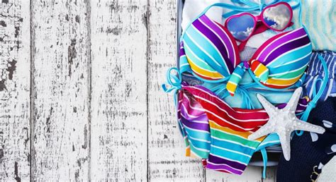 Colorful Bikini And Clothes In Luggage With Tropical Leaves Stock Image Image Of Lovely Green