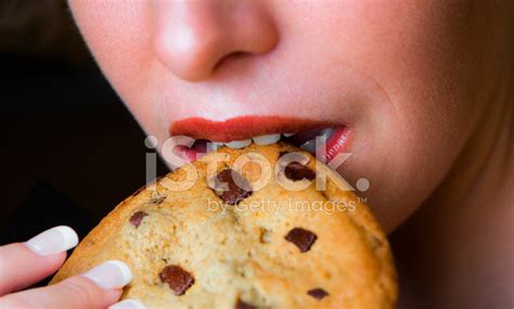 Woman Biting A Chocolate Chip Cookie Stock Photo Royalty Free