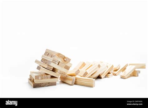 Closeup View Of The Tower Of The Wooden Block Falling On A White