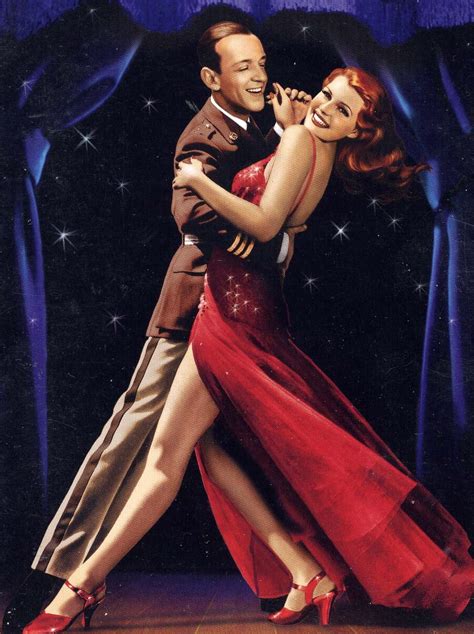 A Man And Woman Dancing Together On Stage