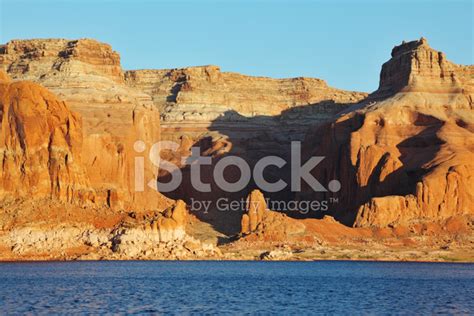 Red Cliffs On The Shores Of Lake Powell Stock Photo Royalty Free