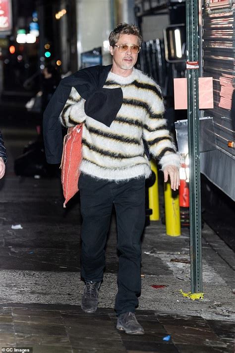 Brad Pitt stylishly presents himself in a fuzzy striped sweater on the ...