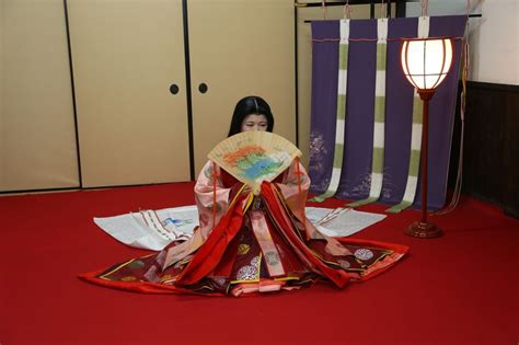 A Woman Dressed In Junihitoe At A Kimono Photography Experience