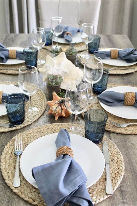 The Table Is Set With Place Settings Napkins And Silverware For Two People