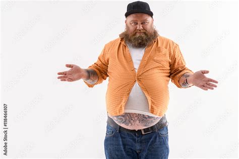 Man Wearing A Shirt That Is Too Small On Him Stock Photo Adobe Stock