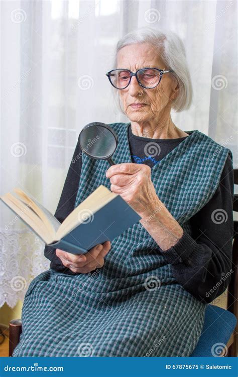 Grandma Reading a Book through Magnifying Glass Stock Image - Image of glasses, grandmother ...