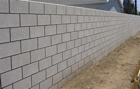 Concrete block wall construction, for retaining wall or extension ...